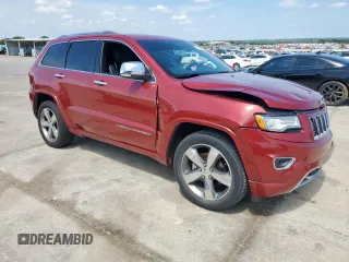 2015 Jeep Grand Cherokee Overland with VIN 1C4RJECG3FC686536, listed as a Copart auction lot 61058215 with 132,282 mi miles and Salvage title. Bid and sale history available at DreamBid. Image 4.