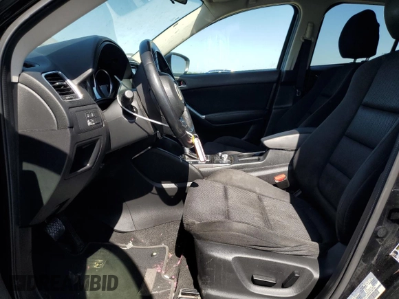 2016 Mazda CX-5 Touring z VIN JM3KE2CY5G0617516, wystawiony jako Copart lot #56421005 z przebiegiem 110 739 mil mil oraz Szkoda całkowita • Salvage title. Historia ofert i sprzedaży dostępna na DreamBid. Obrazek 7.