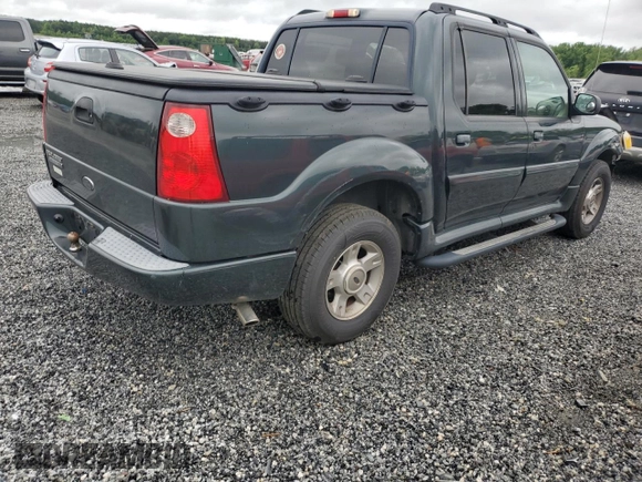 2004 Ford Explorer Sport Trac XLS with VIN 1FMZU67K04UA70503, listed as a Copart auction lot 58214785 with 195,688 mi miles and Salvage title. Bid and sale history available at DreamBid. Image 3.