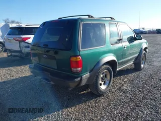 1999 Ford Explorer Sport with VIN 1FMYU24E6XUB80611, listed as a IAAI auction lot 41858826 with 209,656 mi miles and . Bid and sale history available at DreamBid. Image 4.