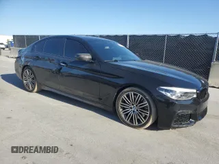 2018 BMW 5 Series M550i xDrive with VIN WBAJB9C52JB035913, listed as a Copart auction lot 51441195 with 42,205 mi miles and Salvage Title. Bid and sale history available at carsss.com. Image 4.