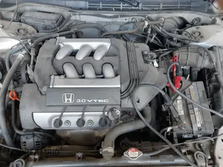 1998 Honda Accord EX z VIN 1HGCG1651WA805964, wystawiony jako IAAI lot #42320827 z przebiegiem 239 279 mil mil oraz . Historia ofert i sprzedaży dostępna na DreamBid. Obrazek 10.