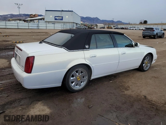 2004 Cadillac DeVille DTS z VIN 1G6KF57944U122824, wystawiony jako Copart lot #86147994 z przebiegiem 118 156 mil mil oraz Szkody całkowita. Historia ofert i sprzedaży dostępna na DreamBid. Obrazek 3.