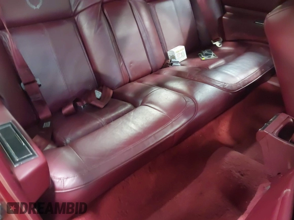 1991 Cadillac DeVille z VIN 1G6CD13B0M4305164, wystawiony jako IAAI lot #42028947 z przebiegiem 33 865 mil mil oraz . Historia ofert i sprzedaży dostępna na DreamBid. Obrazek 8.