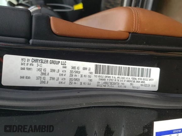 2011 Jeep Grand Cherokee Overland with VIN 1J4RR6GT9BC660730, listed as a Copart auction lot 53770745 with 106,351 mi miles and Salvage title. Bid and sale history available at DreamBid. Image 12.