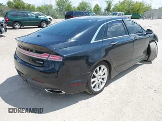 2016 Lincoln MKZ z VIN 3LN6L2J93GR632474, wystawiony jako IAAI lot #42607060 z przebiegiem 99 490 mil mil oraz . Historia ofert i sprzedaży dostępna na DreamBid. Obrazek 4.