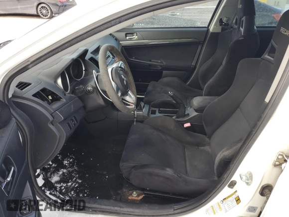 2010 Mitsubishi Lancer Evolution GSR with VIN JA32W8FV4AU604717, listed as a Copart auction lot 83896464 with 140,502 mi miles and Salvage Title. Bid and sale history available at DreamBid. Image 7.