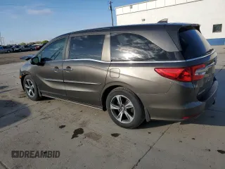 2018 Honda Odyssey Touring с VIN 5FNRL6H8XJB076145, выставлен на аукционе Copart как лот 51870865 с пробегом 96 486 миль миль и Списание • Salvage title. История ставок и продаж доступна на DreamBid. Изображение 2.