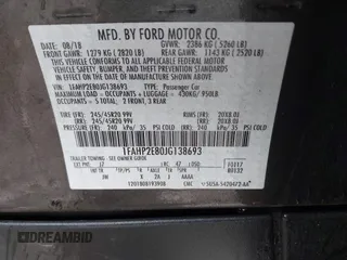 2018 Ford Taurus SEL with VIN 1FAHP2E80JG138693, listed as a IAAI auction lot 41679603 with 110,701 mi miles. Bid and sale history available at carsss.com. Image 9.