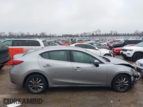 2016 Mazda 3 i Grand Touring z VIN 3MZBM1X74GM245295, wystawiony jako IAAI lot #41079843 z przebiegiem 183 480 mil mil oraz . Historia ofert i sprzedaży dostępna na DreamBid. Obrazek 13.