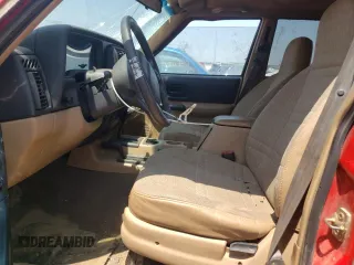 1999 Jeep Cherokee Sport z VIN 1J4FF68SXXL662401, wystawiony jako Copart lot #59698565 z przebiegiem Nie podano mil oraz Szkoda całkowita • Salvage title. Historia ofert i sprzedaży dostępna na DreamBid. Obrazek 7.