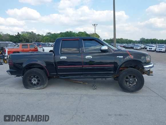 2003 Ford F-150 XLT z VIN 1FTRW08L73KA58913, wystawiony jako IAAI lot #41907277 z przebiegiem 147 294 mil mil oraz . Historia ofert i sprzedaży dostępna na DreamBid. Obrazek 13.