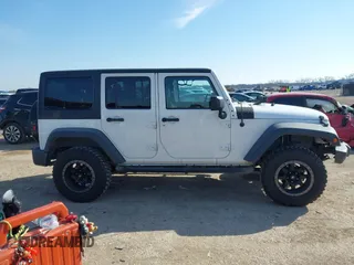 2014 Jeep Wrangler Unlimited Sport with VIN 1C4BJWDG2EL100591, listed as a IAAI auction lot 41578357 with 155,929 mi miles and . Bid and sale history available at DreamBid. Image 13.