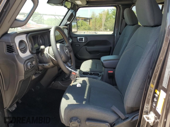 2024 Jeep Wrangler Sport S with VIN 1C4PJXDN4RW102311, listed as a Copart auction lot 56407235 with 23,851 mi miles and Salvage title. Bid and sale history available at DreamBid. Image 7.
