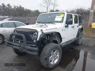 2014 Jeep Wrangler Unlimited Rubicon with VIN 1C4BJWFG9EL274851, listed as a IAAI auction lot 41946440 with 1 mi miles. Bid and sale history available at carsss.com. Image 2.