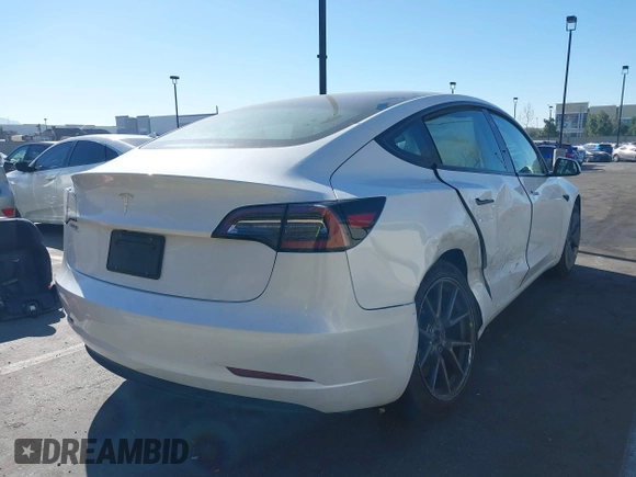 2023 Tesla Model 3 with VIN 5YJ3E1EA6PF411940, listed as a IAAI auction lot 41829537 with 32,877 mi miles and . Bid and sale history available at carsss.com. Image 4.