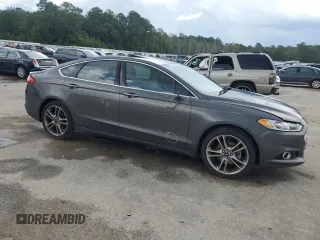 2016 Ford Fusion Titanium with VIN 3FA6P0K90GR180288, listed as a Copart auction lot 60218155 with 140,502 mi miles and Salvage title. Bid and sale history available at DreamBid. Image 4.