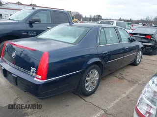 2009 Cadillac DTS 1SA z VIN 1G6KD57Y19U137656, wystawiony jako IAAI lot #41531439 z przebiegiem 103 151 mil mil oraz . Historia ofert i sprzedaży dostępna na DreamBid. Obrazek 4.