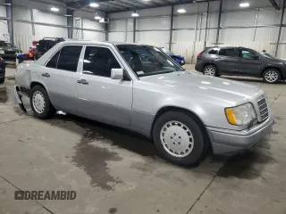1995 Mercedes-Benz E 320 with VIN WDBEA32E2SC168493, listed as a Copart auction lot 82365704 with 102,066 mi miles and Salvage Title. Bid and sale history available at DreamBid. Image 4.