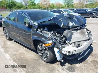 2018 Honda Civic EX-T z VIN JHMFC1F32JX024932, wystawiony jako IAAI lot #42151005 z przebiegiem 147 901 mil mil oraz . Historia ofert i sprzedaży dostępna na DreamBid. Obrazek 1.