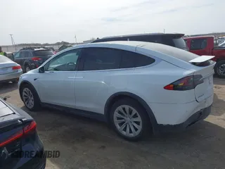 2018 Tesla Model X 75D with VIN 5YJXCBE27JF121834, listed as a IAAI auction lot 41769246 with 90,814 mi miles and . Bid and sale history available at carsss.com. Image 14.