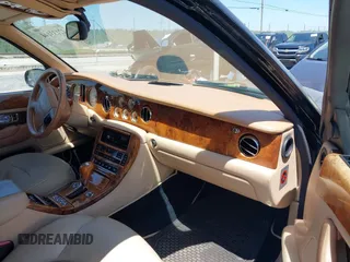 1999 Bentley Arnage z VIN SCBLB51E1XCX01401, wystawiony jako IAAI lot #42133144 z przebiegiem 29 699 mil mil oraz . Historia ofert i sprzedaży dostępna na DreamBid. Obrazek 5.