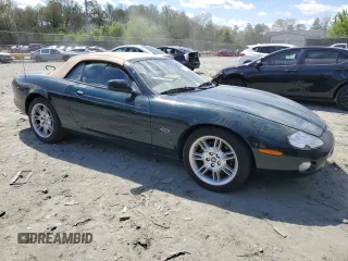 2002 Jaguar XK with VIN SAJDA42C22NA23724, listed as a Copart auction lot 53521005 with 61,468 mi miles and Salvage Title. Bid and sale history available at DreamBid. Image 4.