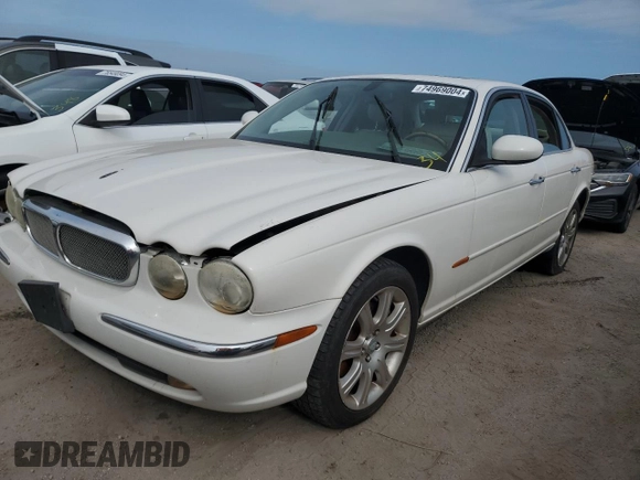 2004 Jaguar XJ with VIN SAJWA71C44SG34094, listed as a Copart auction lot 74969004 with 0 mi miles and Salvage Title. Bid and sale history available at carsss.com. Image 1.