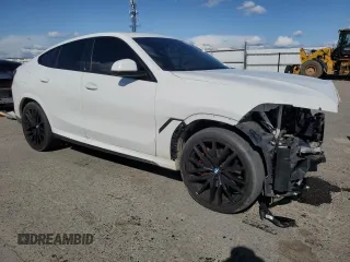 2023 BMW X6 xDrive40i z VIN 5UXCY6C04P9P49005, wystawiony jako Copart lot #51974695 z przebiegiem 30 421 mil mil oraz Szkoda całkowita • Salvage title. Historia ofert i sprzedaży dostępna na DreamBid. Obrazek 4.