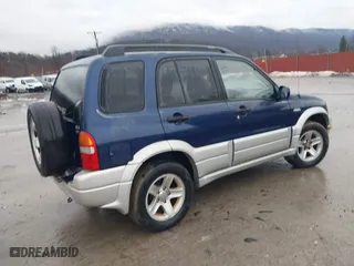 2003 Suzuki Grand Vitara with VIN JS3TD62V134105917, listed as a IAAI auction lot 41415963 with 87,548 mi miles. Bid and sale history available at carsss.com. Image 4.