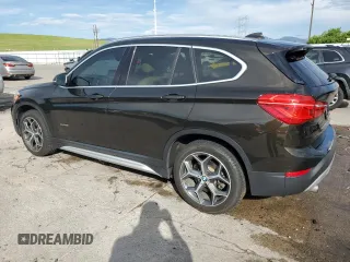2017 BMW X1 xDrive28i with VIN WBXHT3C32H5F71690, listed as a Copart auction lot 60852375 with 67,475 mi miles and Salvage title. Bid and sale history available at DreamBid. Image 2.