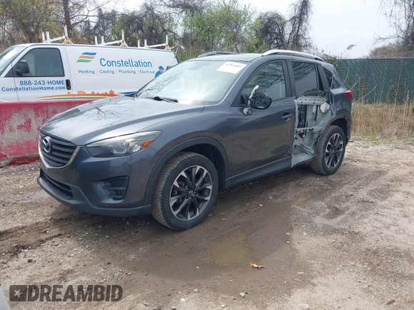 2016 Mazda CX-5 Grand Touring with VIN JM3KE4DYXG0830150, listed as a IAAI auction lot 41961007 with 142,570 mi miles and . Bid and sale history available at DreamBid. Image 19.
