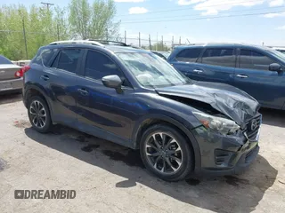 2016 Mazda CX-5 Grand Touring with VIN JM3KE4DY7G0643643, listed as a IAAI auction lot 42077497 with 120,343 mi miles and . Bid and sale history available at carsss.com. Image 13.