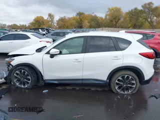2016 Mazda CX-5 Grand Touring with VIN JM3KE4DY0G0705691, listed as a IAAI auction lot 40880798 with 130,624 mi miles. Bid and sale history available at carsss.com. Image 14.