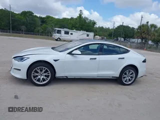 2022 Tesla Model S Plaid with VIN 5YJSA1E6XNF473888, listed as a IAAI auction lot 42141141 with 28,584 mi miles and . Bid and sale history available at carsss.com. Image 14.