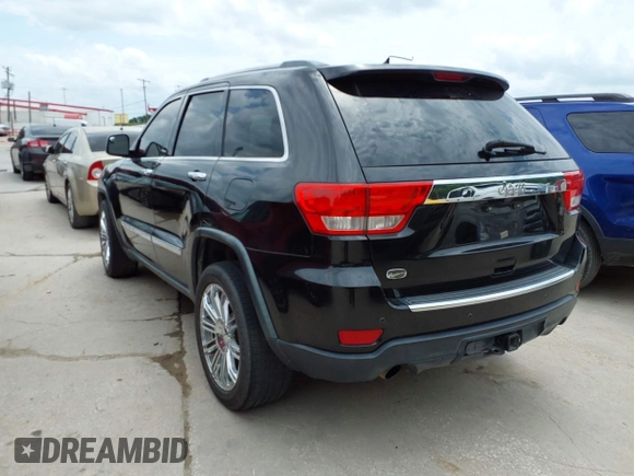 2013 Jeep Grand Cherokee Overland with VIN 1C4RJECT2DC588124, listed as a IAAI auction lot 42142573 with 204,309 mi miles and . Bid and sale history available at DreamBid. Image 3.