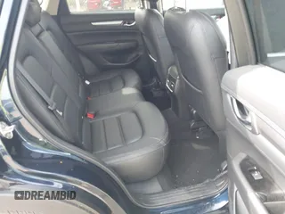 2021 Mazda CX-5 Touring z VIN JM3KFBCMXM0389857, wystawiony jako IAAI lot #42309650 z przebiegiem 49 938 mil mil oraz . Historia ofert i sprzedaży dostępna na DreamBid. Obrazek 8.