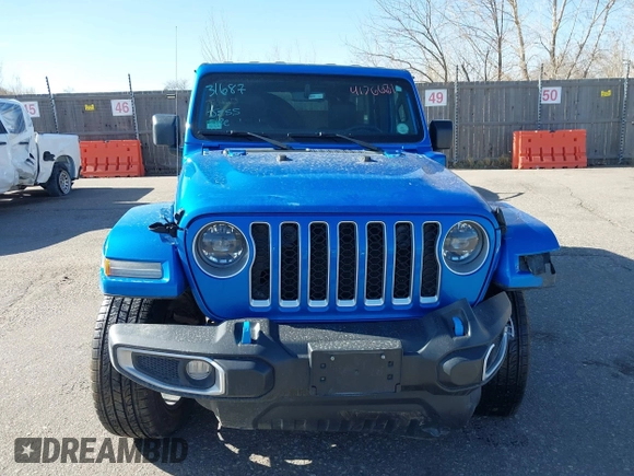 2023 Jeep Wrangler Sahara z VIN 1C4JJXP60PW513969, wystawiony jako IAAI lot #41766631 z przebiegiem 34 819 mil mil oraz . Historia ofert i sprzedaży dostępna na DreamBid. Obrazek 13.