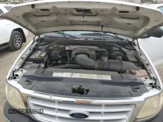 1999 Ford F-150 XL z VIN 1FTRF17L3XKA66147, wystawiony jako Copart lot #69105514 z przebiegiem 179 426 mil mil oraz Czysty tytuł • Clean title. Historia ofert i sprzedaży dostępna na DreamBid. Obrazek 11.