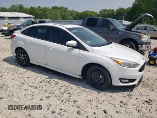 2015 Ford Focus SE with VIN 1FADP3F28FL332899, listed as a Copart auction lot 60055185 with 76,948 mi miles and Clean title. Bid and sale history available at DreamBid. Image 4.