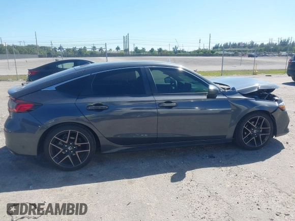 2023 Honda Civic Sport Touring z VIN 19XFL1H80PE017819, wystawiony jako IAAI lot #41833813 z przebiegiem 26 279 mil mil oraz . Historia ofert i sprzedaży dostępna na DreamBid. Obrazek 13.