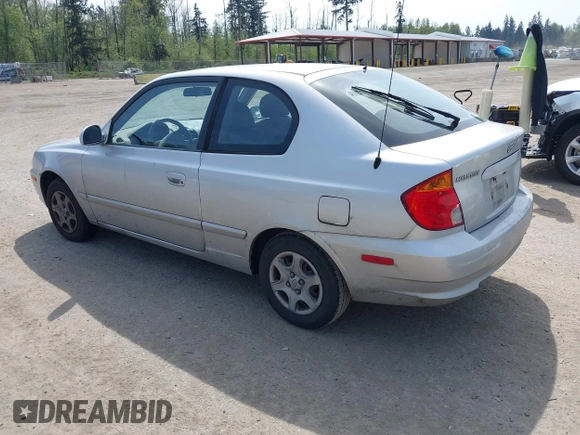 2005 Hyundai Accent GLS with VIN KMHCG35C65U332999, listed as a IAAI auction lot 42097932 with 225,593 mi miles. Bid and sale history available at carsss.com. Image 3.