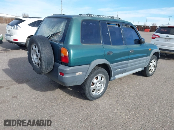 1997 Toyota RAV4 with VIN JT3HP10V2V0147285, listed as a IAAI auction lot 41856796 with 303,535 mi miles and . Bid and sale history available at DreamBid. Image 4.