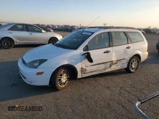 2003 Ford Focus with VIN 1FAHP36Z53W254395, listed as a Copart auction lot 73870944 with 82,010 mi miles and Salvage title. Bid and sale history available at DreamBid. Image 1.
