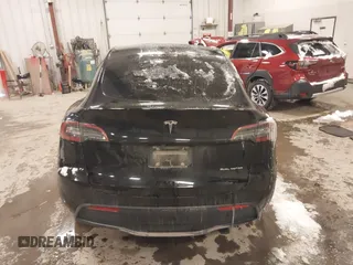 2024 Tesla Model Y Long Range with VIN 7SAYGDEEXRF085795, listed as a IAAI auction lot 41609867 with 57,049 mi miles. Bid and sale history available at carsss.com. Image 15.