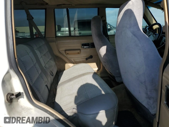 1996 Jeep Cherokee SE z VIN 1J4FJ28S7TL270218, wystawiony jako Copart lot #55302885 z przebiegiem 239 209 mil mil oraz Szkoda całkowita • Salvage title. Historia ofert i sprzedaży dostępna na DreamBid. Obrazek 10.