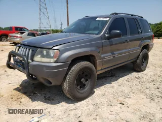 2004 Jeep Grand Cherokee Laredo with VIN 1J4GW48S34C180017, listed as a Copart auction lot 59214495 with 319,554 mi miles and Salvage title. Bid and sale history available at DreamBid. Image 1.