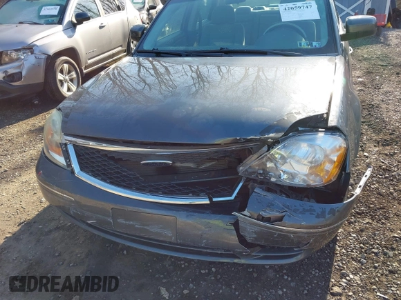 2005 Ford Five Hundred SE z VIN 1FAFP231X5G145153, wystawiony jako IAAI lot #42059747 z przebiegiem 59 114 mil mil oraz . Historia ofert i sprzedaży dostępna na DreamBid. Obrazek 6.