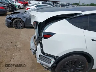 2023 Tesla Model Y Long Range with VIN 7SAYGAEEXPF776370, listed as a IAAI auction lot 42127512 with 27,120 mi miles and . Bid and sale history available at DreamBid. Image 23.