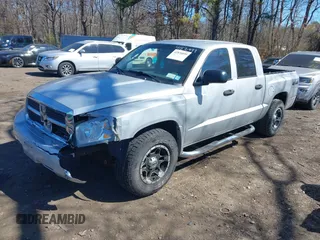 2006 Dodge Dakota SLT z VIN 1D7HW48N76S507358, wystawiony jako IAAI lot #41876899 z przebiegiem 131 880 mil mil oraz . Historia ofert i sprzedaży dostępna na DreamBid. Obrazek 2.